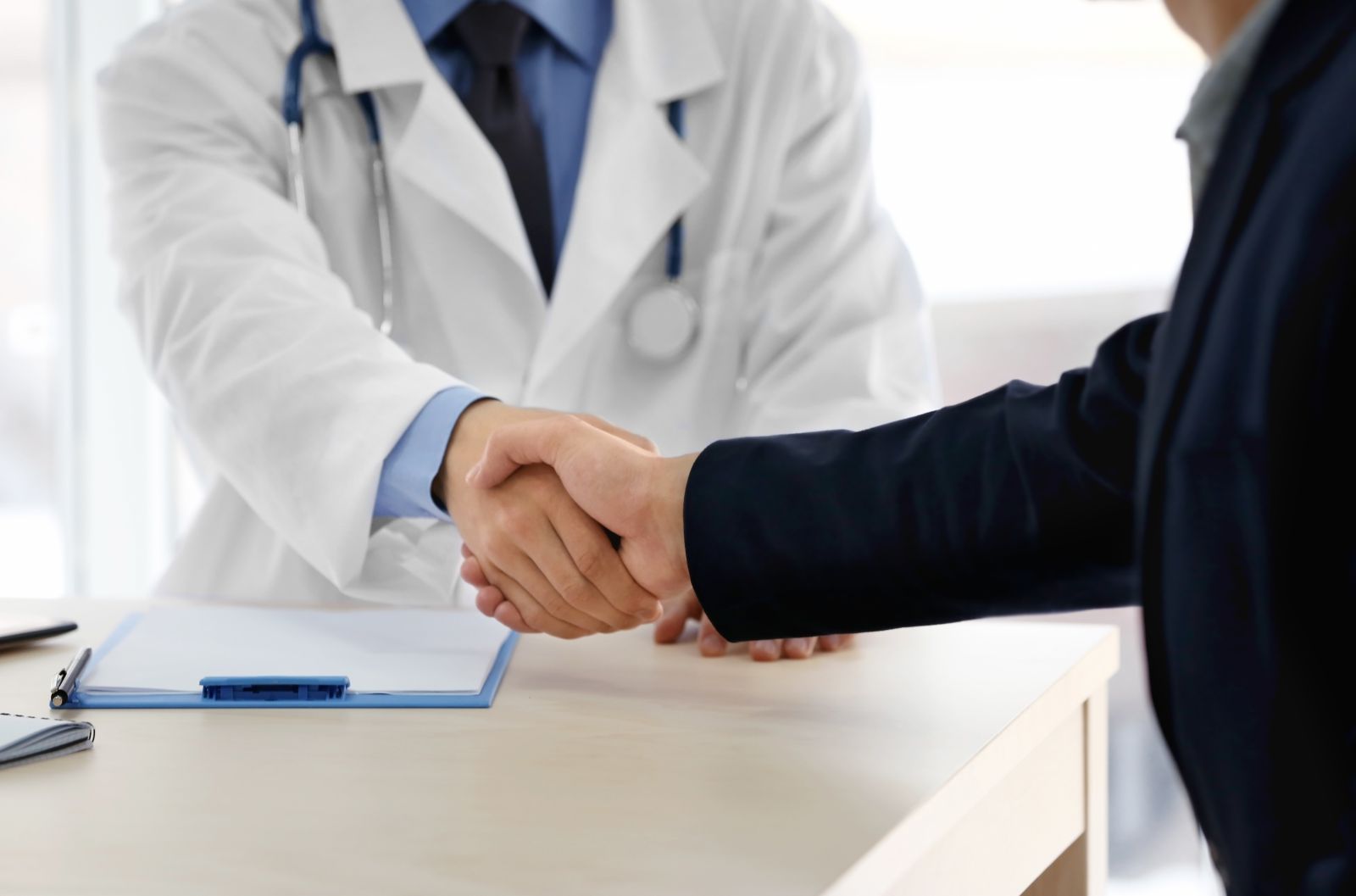 Physician shaking hands