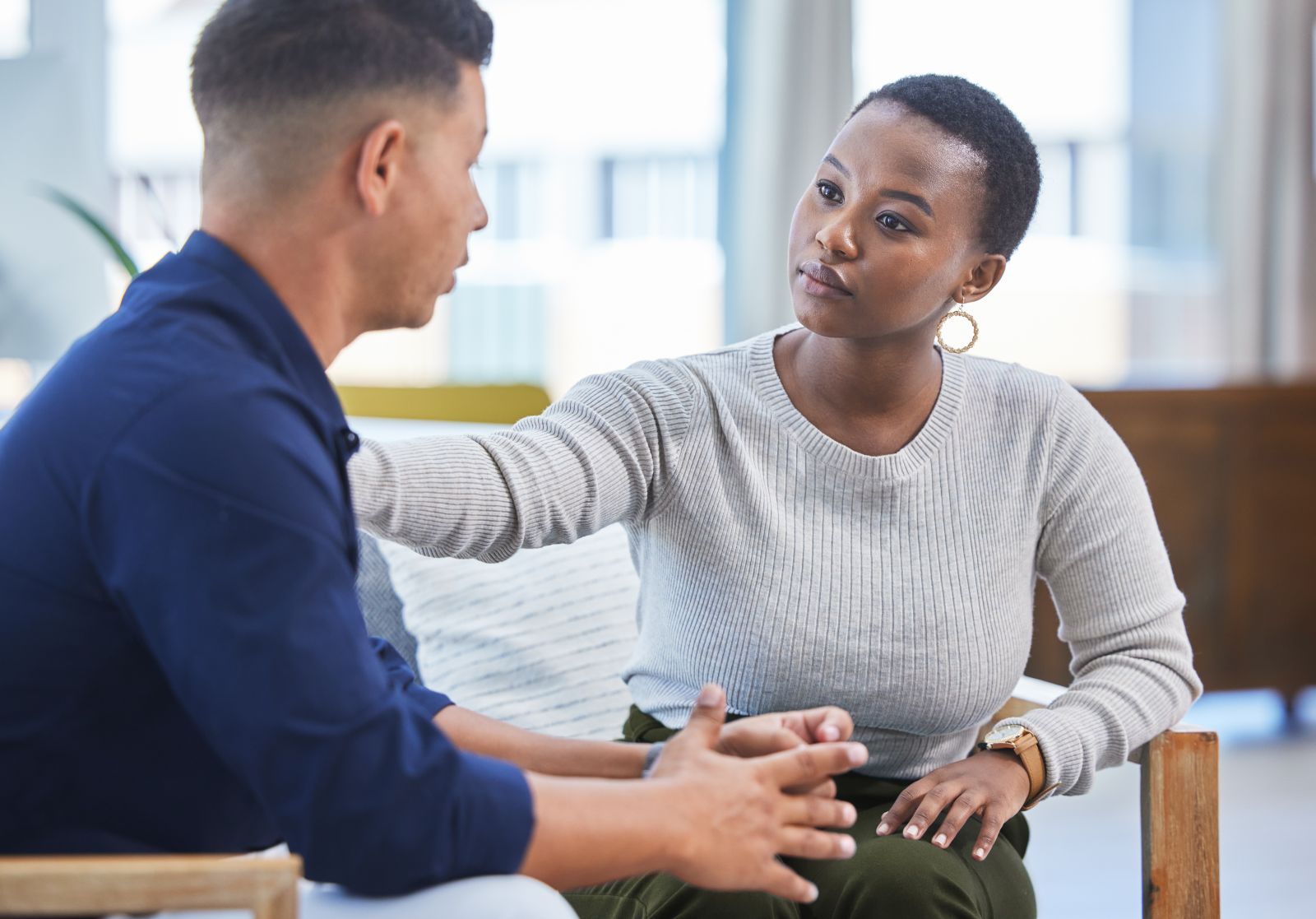 Image of woman comforting anxious patient.